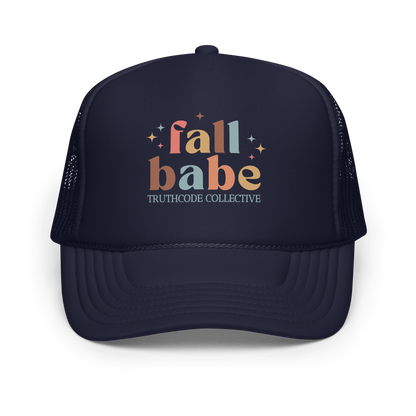 Navy blue trucker hat with 'fall babe' text and 'TRUTHCODE COLLECTIVE' on a white background