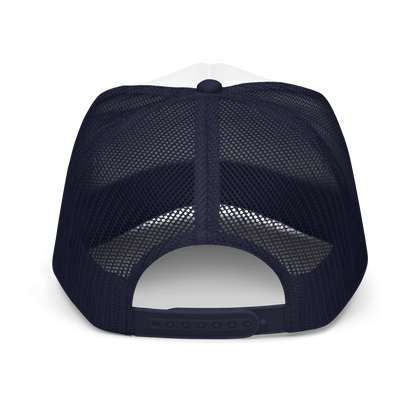 Back of navy blue mesh trucker hat showing adjustable snaps on a plain background