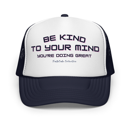 White and navy blue trucker hat with text 'Be kind to your mind, you're doing great' on a white background