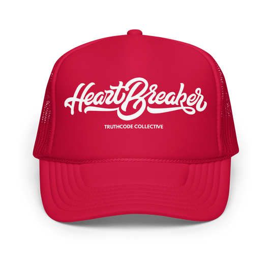 Red trucker hat with 'Heart Breaker' and 'Truthcode Collective' text on a white background