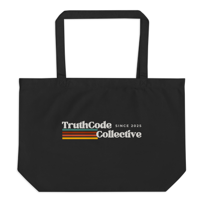 Black organic tote bag with retro 'TruthCode Collective' logo on a white background