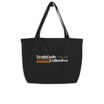 Black organic tote bag with retro 'TruthCode Collective' logo on a white background