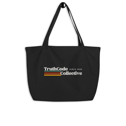 Black organic tote bag with retro 'TruthCode Collective' logo on a white background