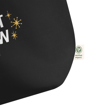 Close view of black organic tote with a  certified organic label on a white background