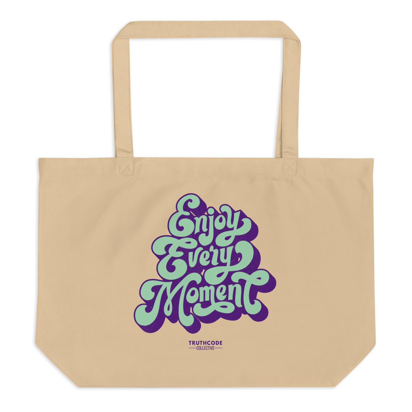 Beige organic tote bag with 'Enjoy Every Moment' text in purple and green on a white background