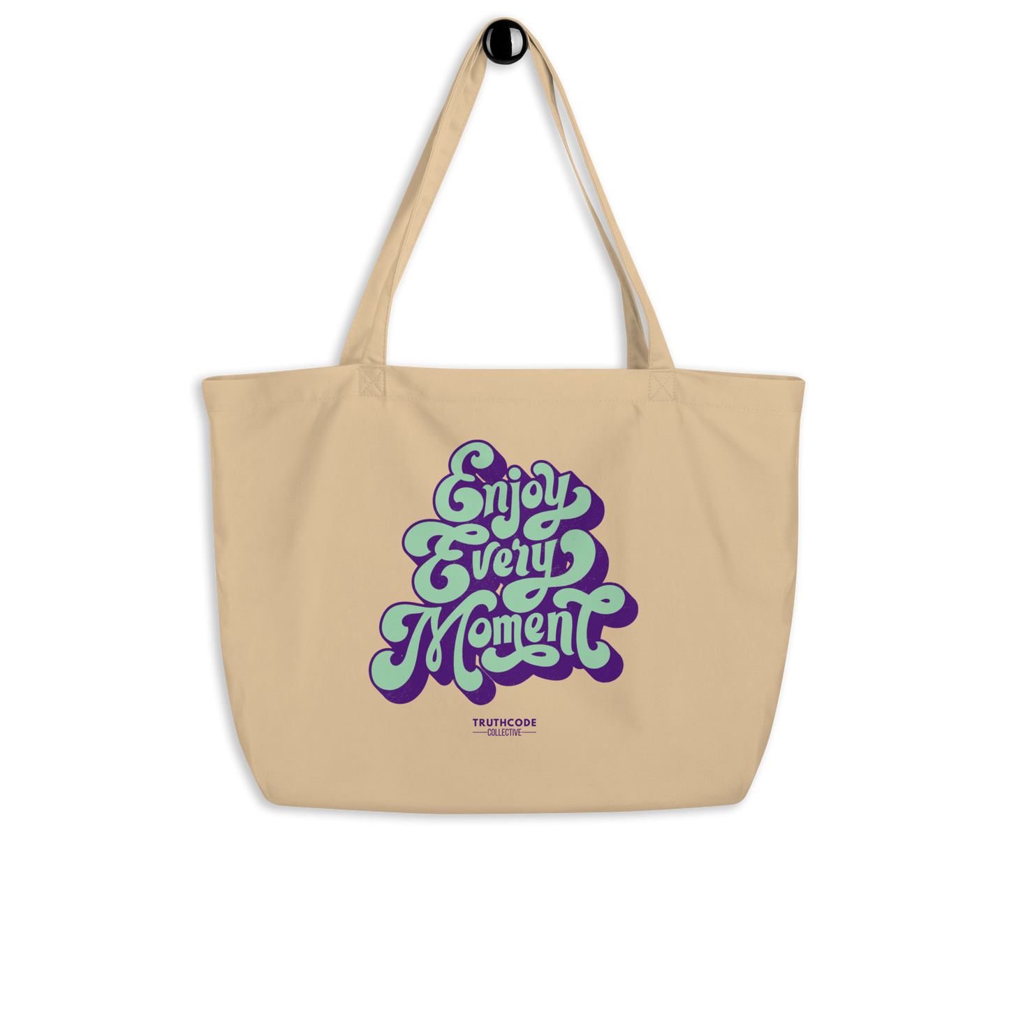 Beige organic tote bag with 'Enjoy Every Moment' text design on a white background