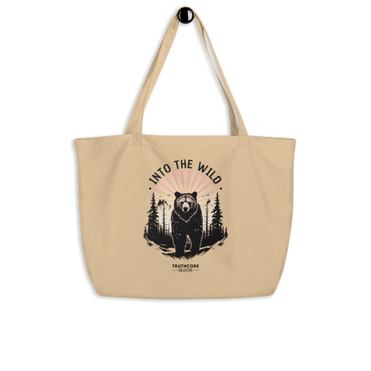 Beige organic tote bag with bear graphic and 'Into the Wild' text on a white background