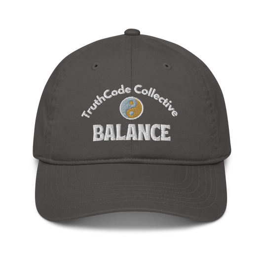 Dark gray cap with 'TruthCode Collective' and 'Balance' text with yin yang design, on a white background