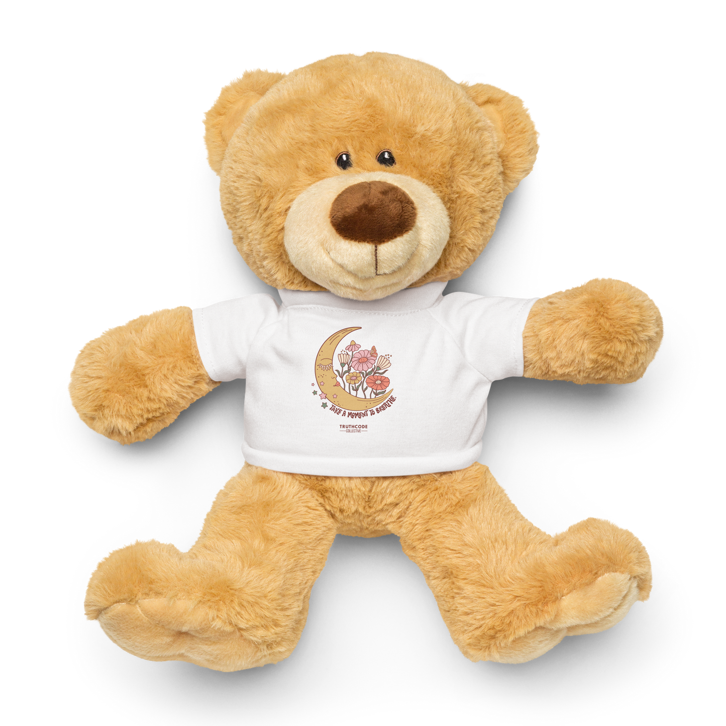 Plush teddy bear wearing a white shirt with a moon and flower design and text 'Take a moment to breathe', on a white background