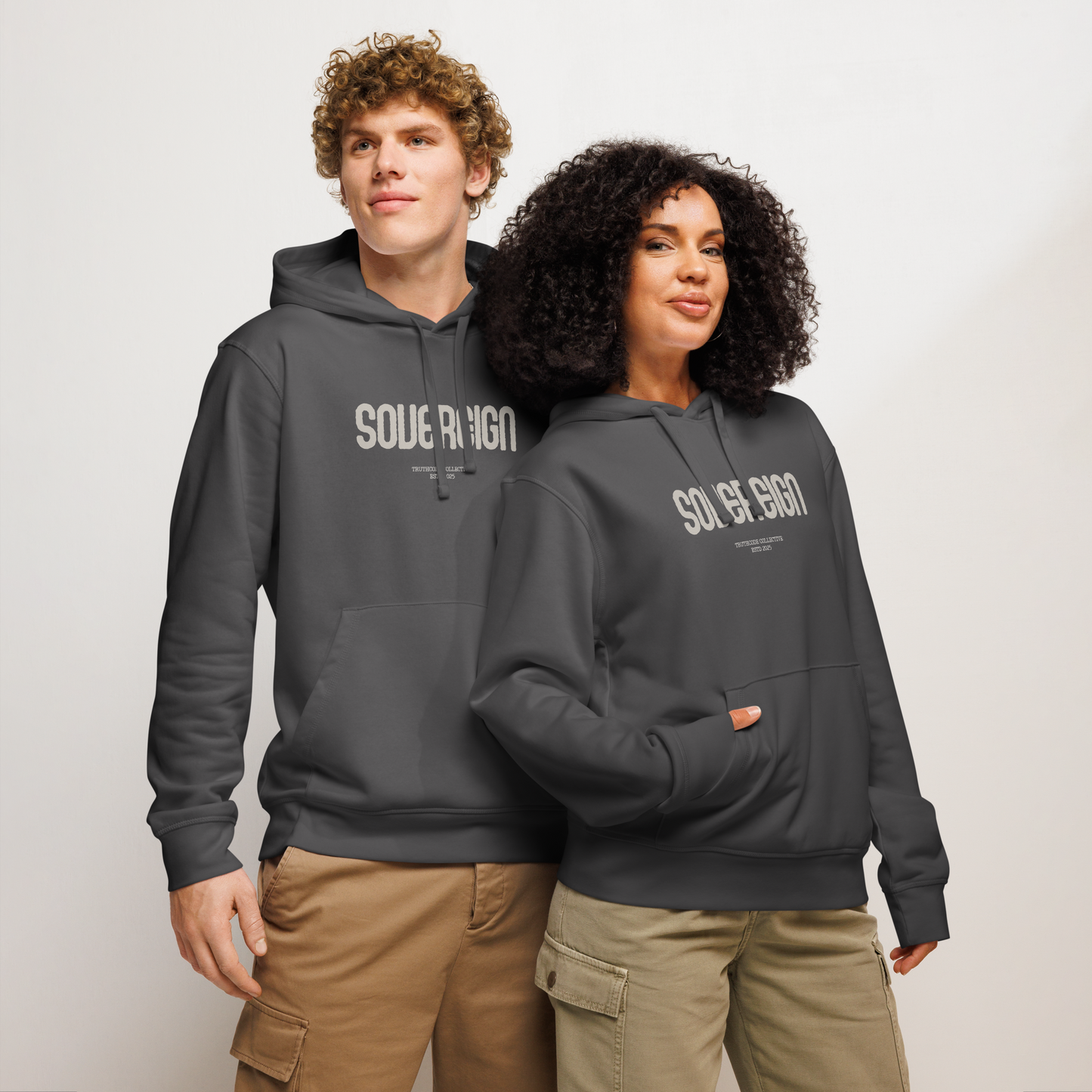 Models wearing dark gray organic hoodie with 'SOVEREGN' text design on a white background