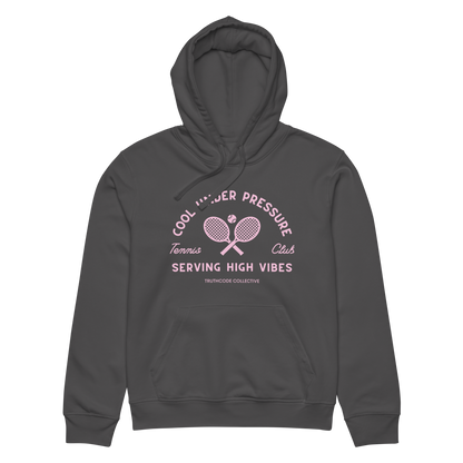 Dark gray organic hoodie with pink and white text 'Cool under pressure, serving high vibes' and tennis graphics on a white background