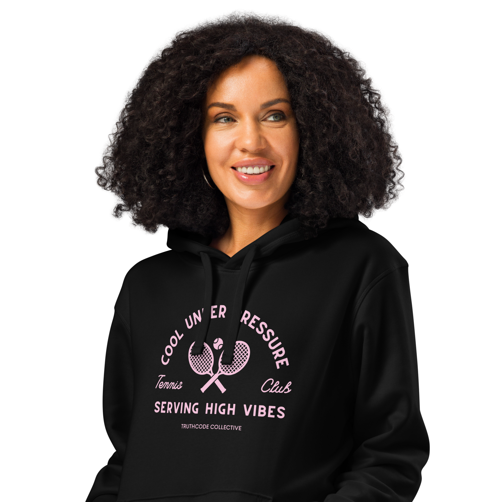 Woman wearing black organic hoodie with text 'Cool under pressure, serving high vibes' and 'Tennis club' with a tennis racket design on a white background