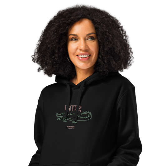 Woman wearing black organic hoodie with text 'Later' and alligator graphic design on a white background