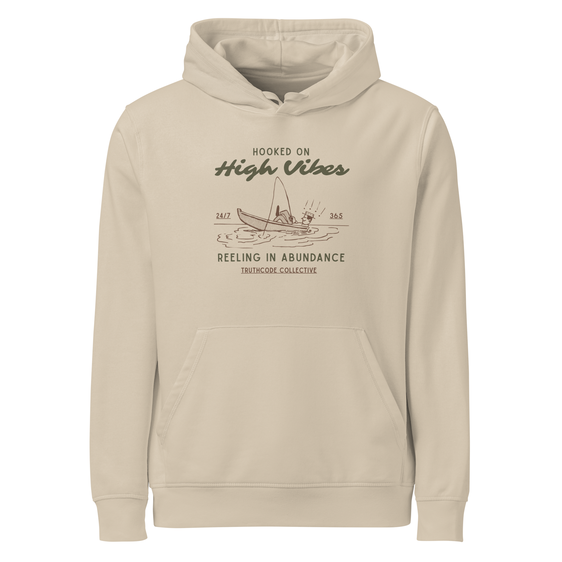 Beige organic hoodie with text 'Hooked on High Vibes, reeling in abundance' and graphic design of a fishing boat on a white background