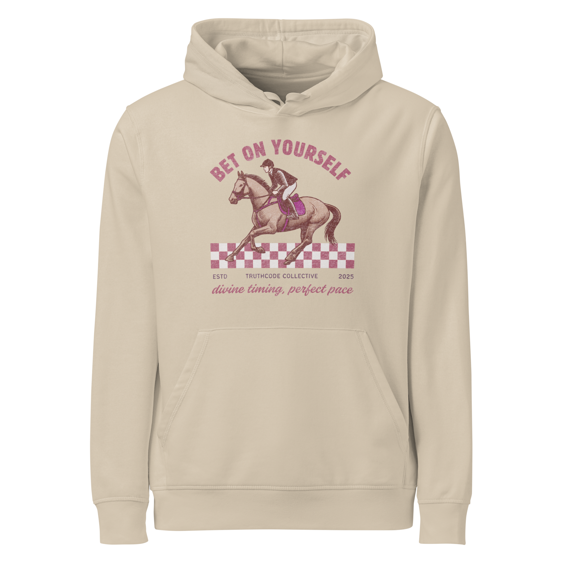 Beige organic hoodie with horse and rider graphic and text 'Bet on yourself, divine timing, perfect pace' on a white background