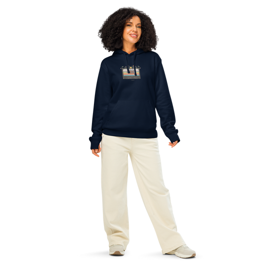 Woman wearing navy blue organic hoodie with a graphic design of cassette tape and 'Vintage soul' text, against a white background