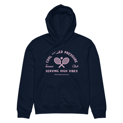 Navy blue organic hoodie with pink and white text 'Cool under pressure, serving high vibes' and tennis graphics on a white background