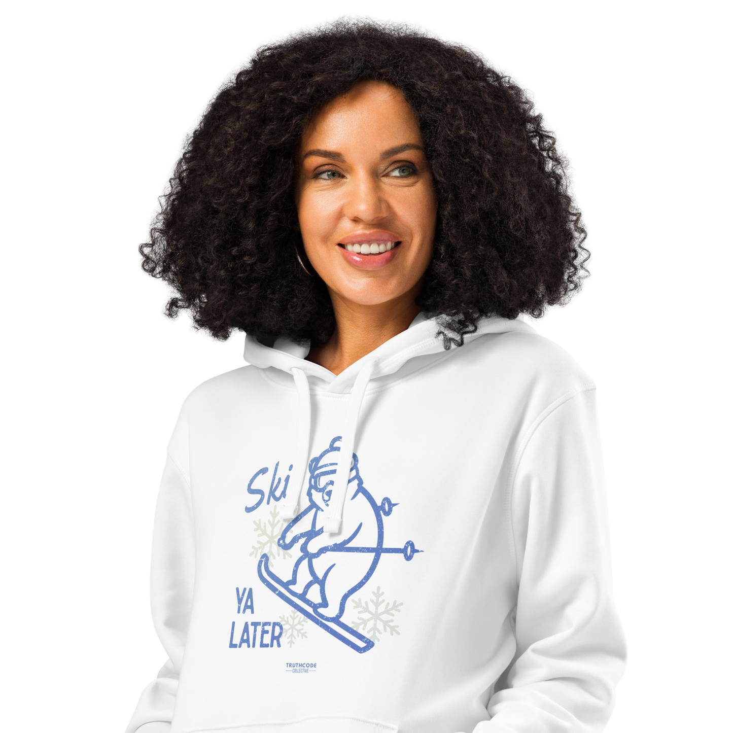 Woman wearing white organic hoodie with a skiing bear graphic and text 'Ski you later' on a white background