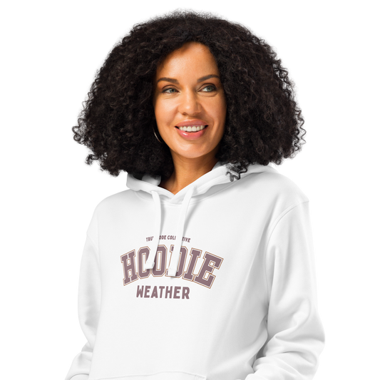 Woman wearing white organic hoodie with 'Hoodie Weather' text on a white background