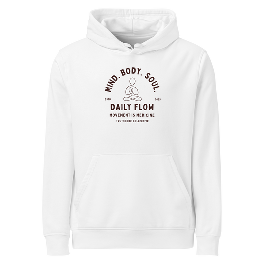 White organic hoodie with 'Daily Flow, movement is medicine' and 'Mind. Body. Soul' text and a line drawing graphic of a person meditating
