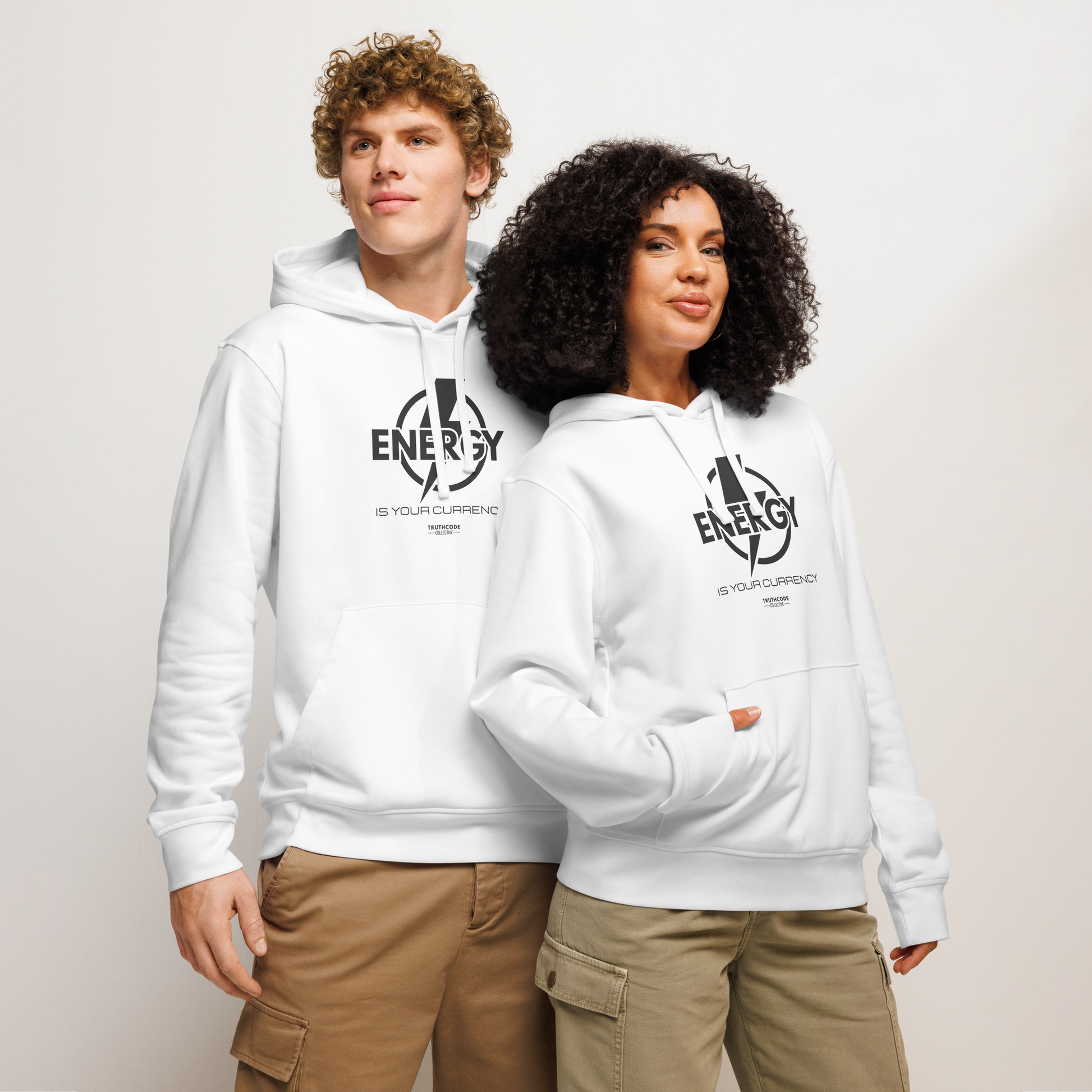 Models wearing white organic hoodie with lightening bolt graphic and text 'Energy is your currency' on a white background