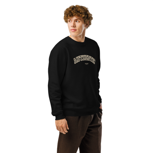 Guy wearing black organic sweatshirt with 'AUTHENTIC' text, on a white background