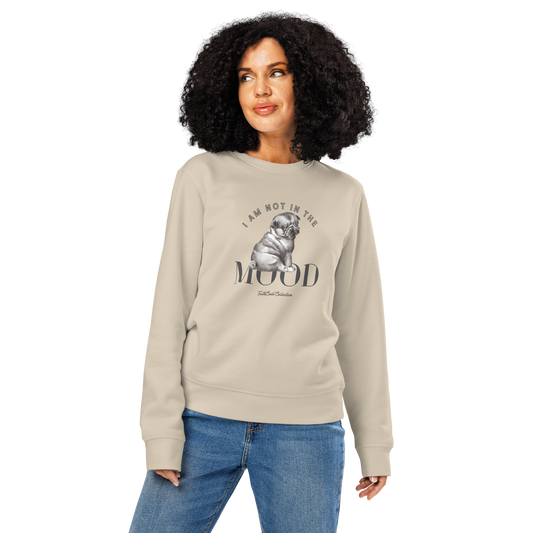 Woman wearing beige organic sweatshirt with a pug graphic and text 'I am not in the mood' on a white background