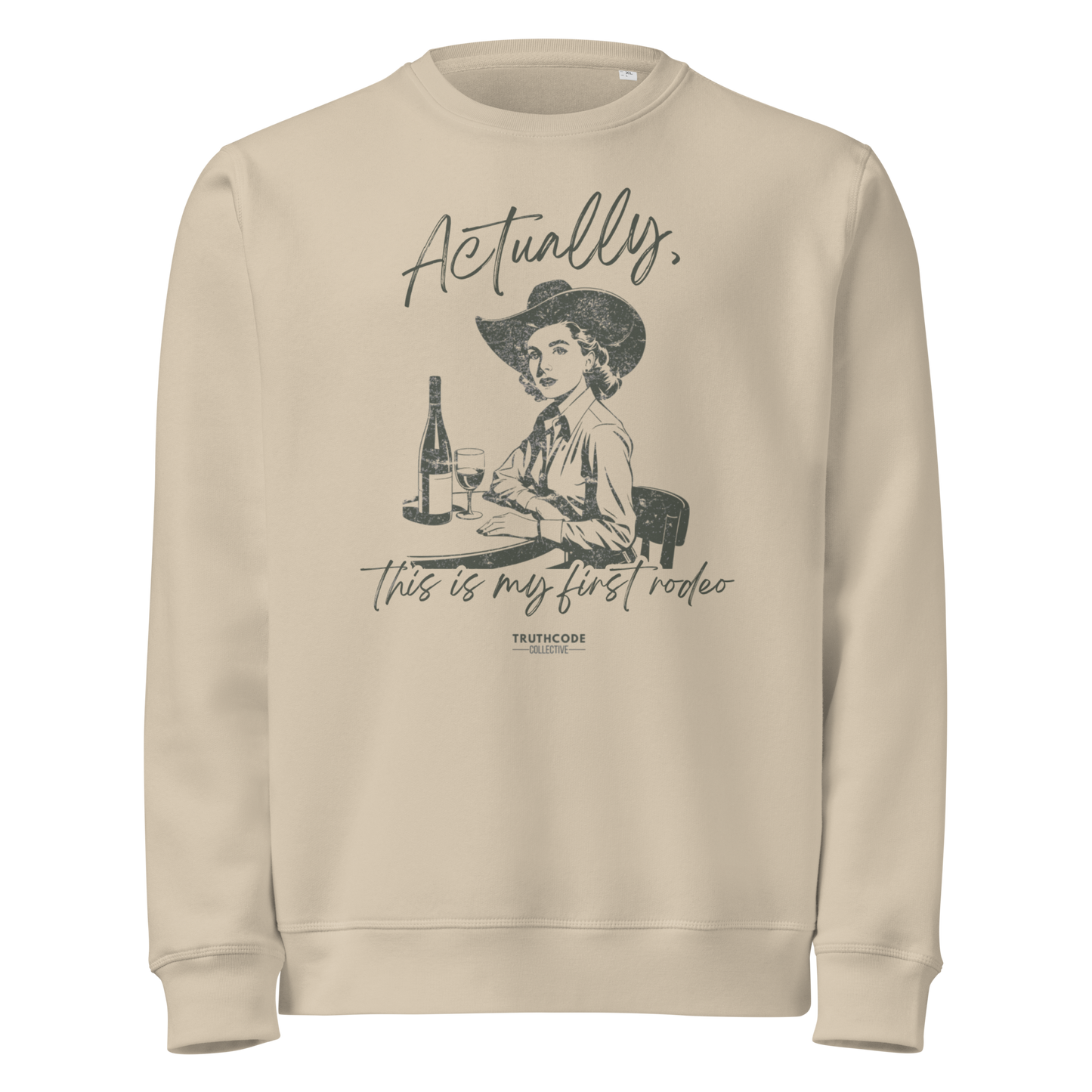 Beige organic sweatshirt with vintage graphic of a woman in a cowboy hat and text 'Actually, this is my first rodeo' on a white background