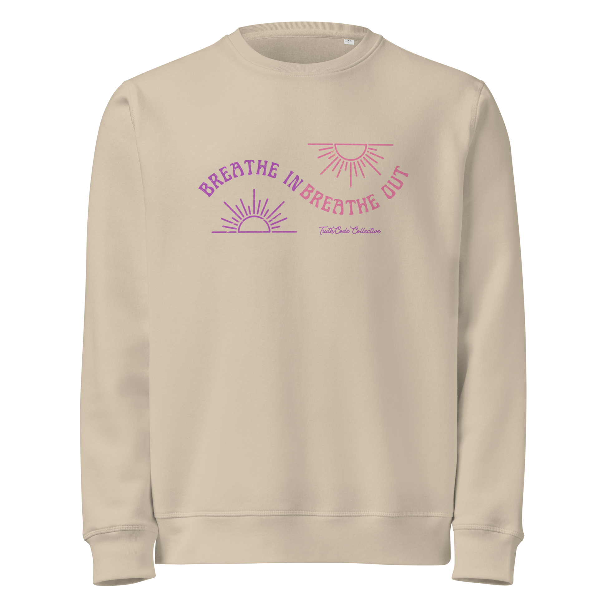 Beige organic sweatshirt with pink and purple sun design and text 'Breathe in breathe out' on a white background