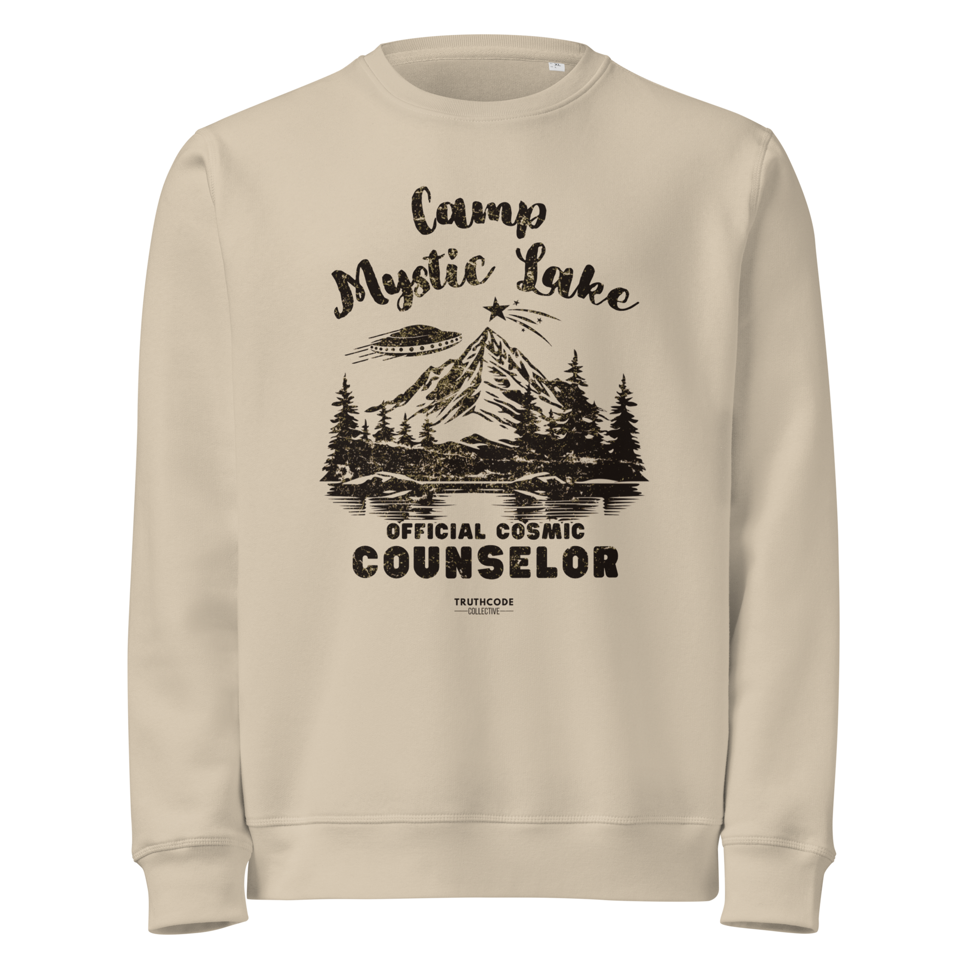 Beige organic sweatshirt with mountain scene and spaceship graphic design and text 'Camp Mystic Lake, official cosmic counselor' on a white background