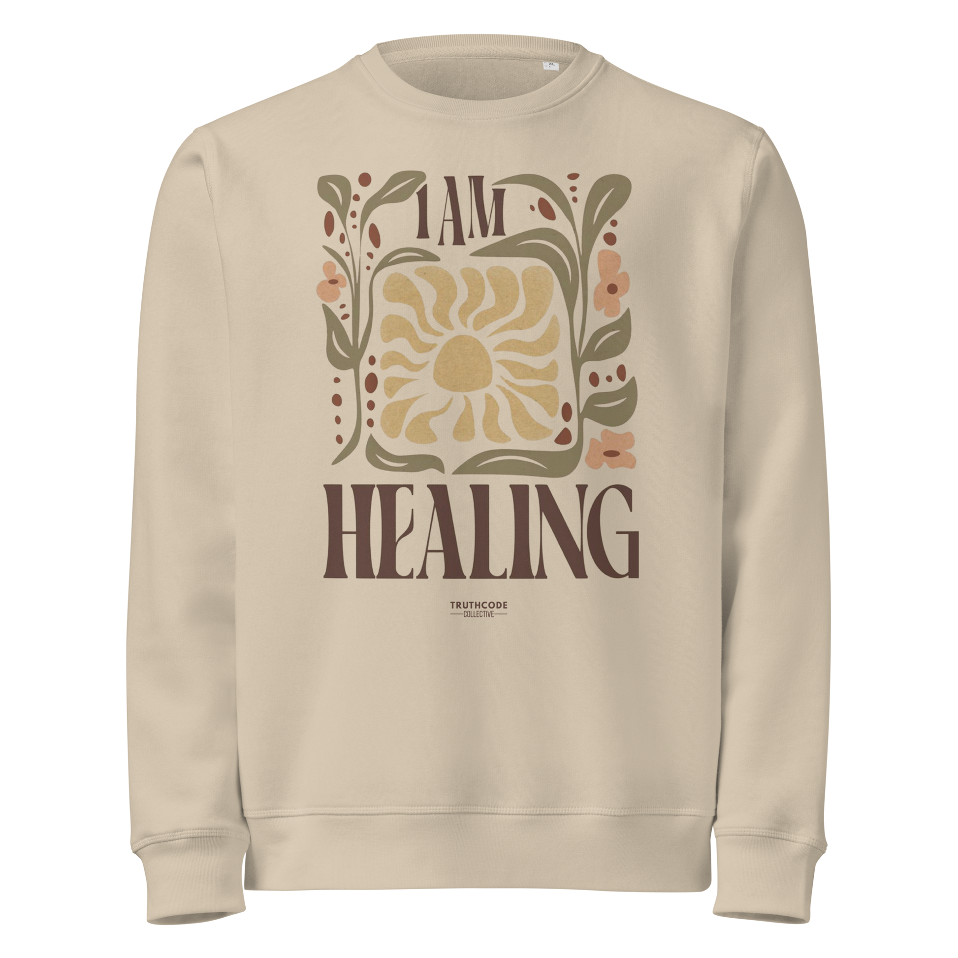 Beige organic sweatshirt with 'I AM HEALING' text and sun and plants design on a white background