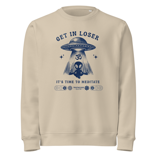 Beige organic sweatshirt with alien and spaceship graphic and text 'Get in loser, it's time to meditate' on a white background