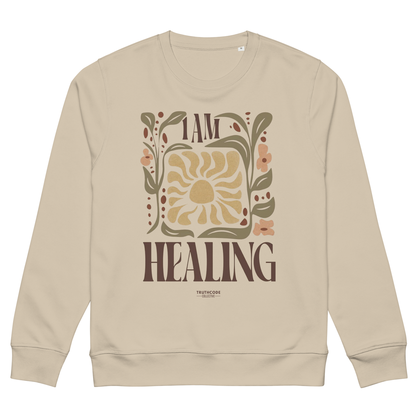 Beige organic sweatshirt with 'I AM HEALING' text and floral design on a white background