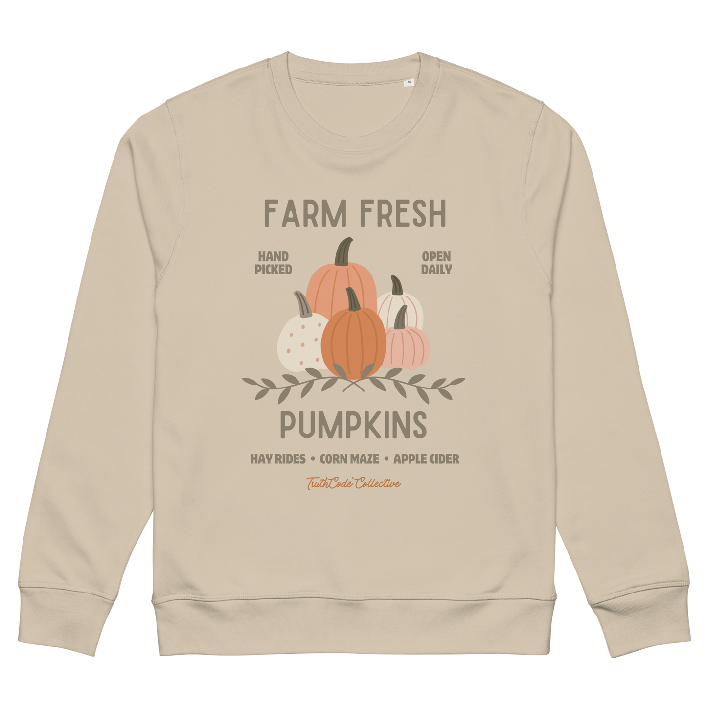 Beige organic sweatshirt with pumpkin graphic and text 'Farm fresh pumpkins, hay rides, corn maze, apple cider'  on a white background
