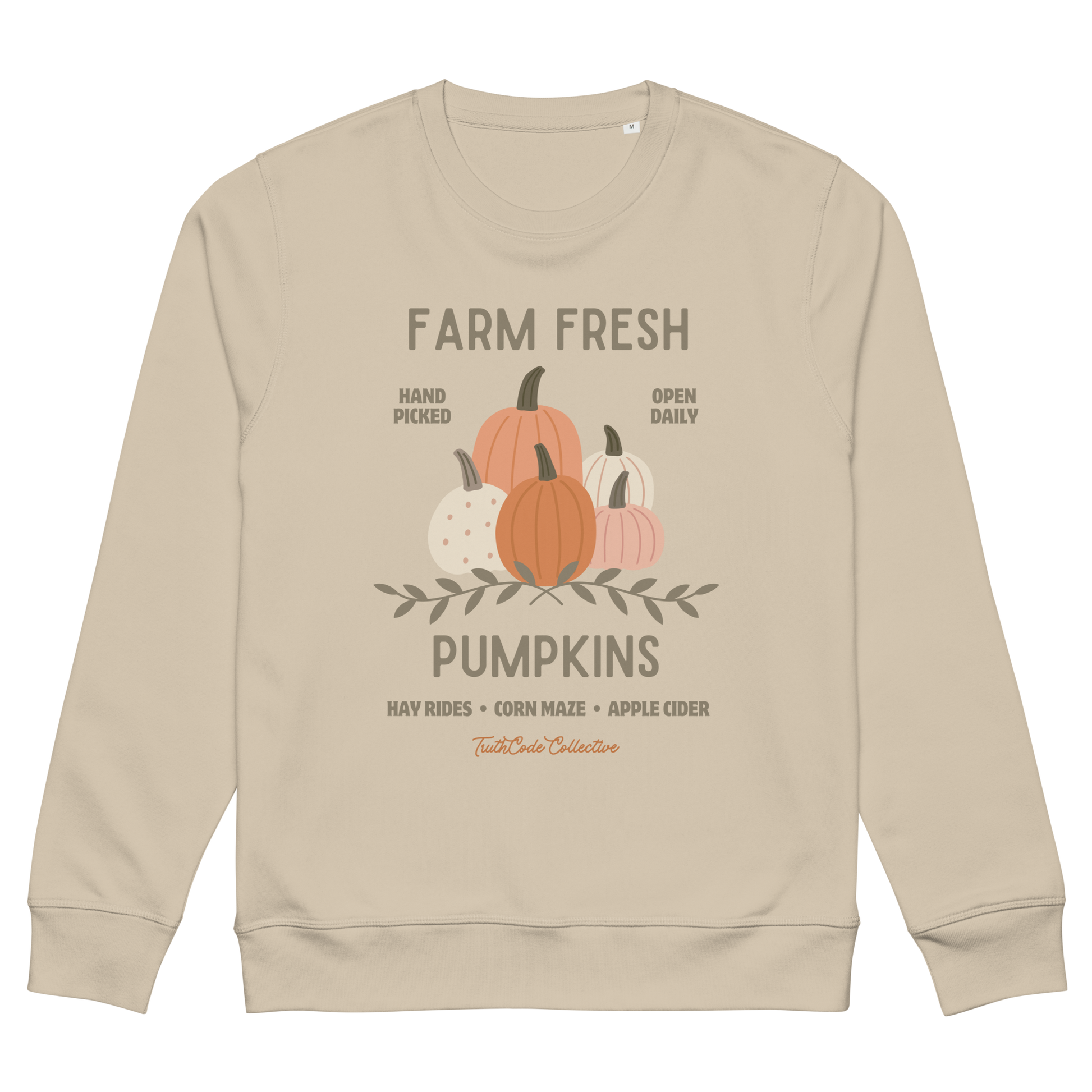 Beige organic sweatshirt with pumpkin graphic and text 'Farm fresh pumpkins, hay rides, corn maze, apple cider'  on a white background