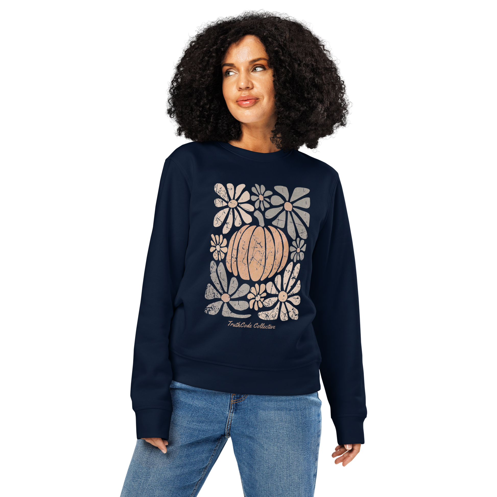 Woman wearing navy blue organic sweatshirt with a pumpkin and floral design on a white background