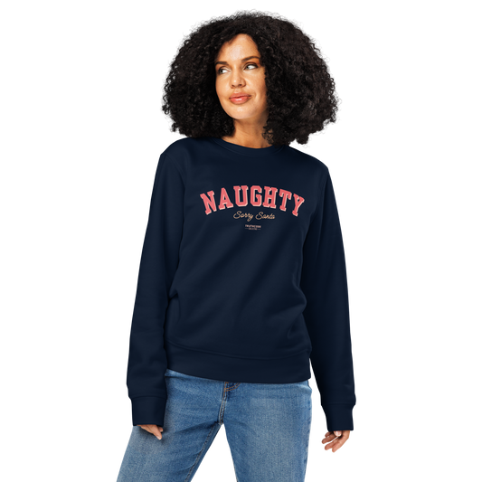 Woman wearing navy blue organic sweatshirt with 'NAUGHTY, sorry Santa' text in red on a white background