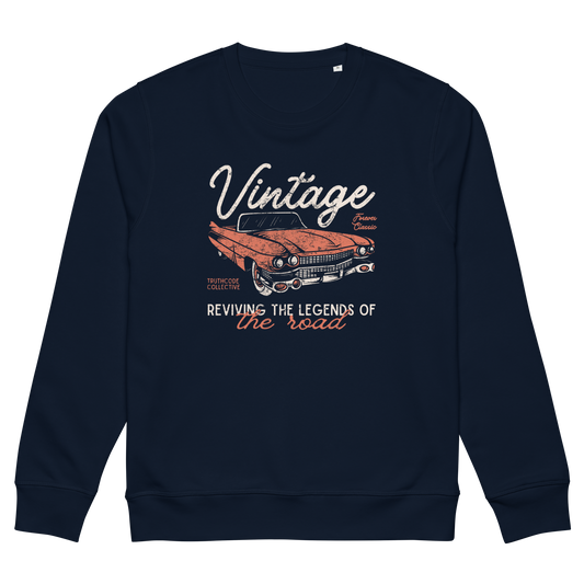 Navy blue organic sweatshirt with vintage car graphic and text 'Vintage, reviving the legends of the road' on a white background