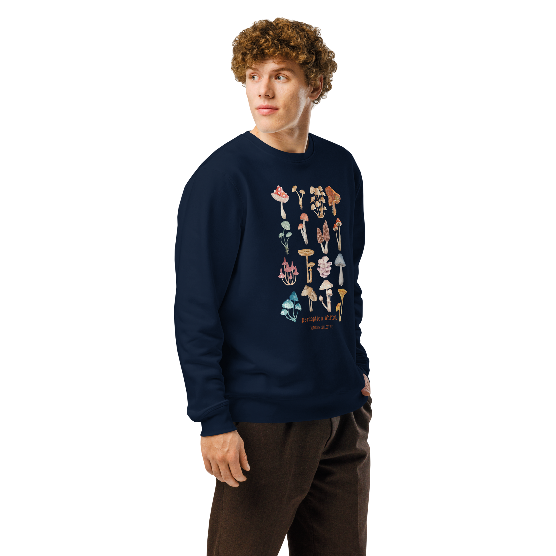 Guy wearing navy blue organic sweatshirt with colorful mushroom illustrations and text 'Perception shifted' on a white background