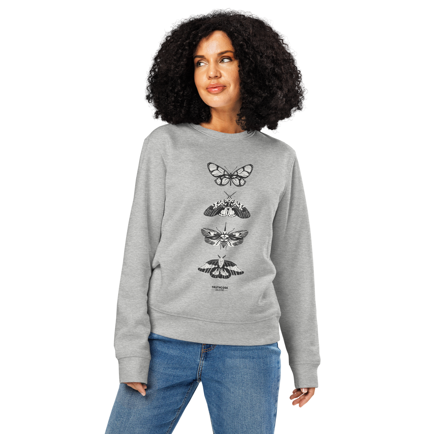 Woman wearing gray organic sweatshirt with various butterfly designs on a white background