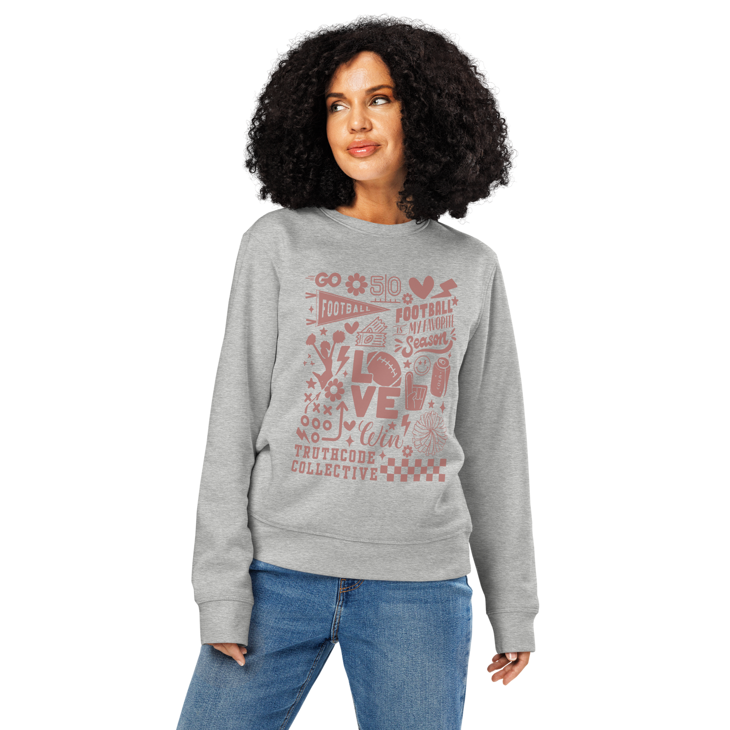 Woman wearing gray organic sweatshirt with football themed graphics and text 'Football is my favorite season' on a white background