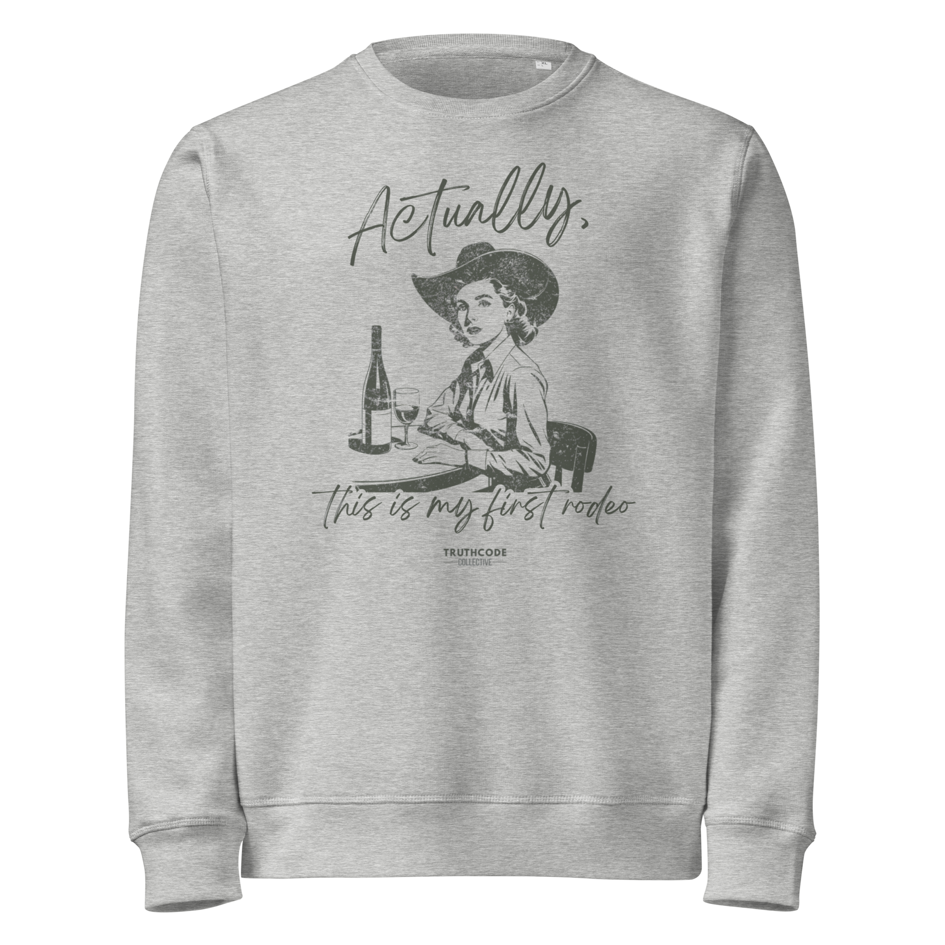 Gray organic sweatshirt with vintage graphic of a woman in a cowboy hat and text 'Actually, this is my first rodeo' on a white background