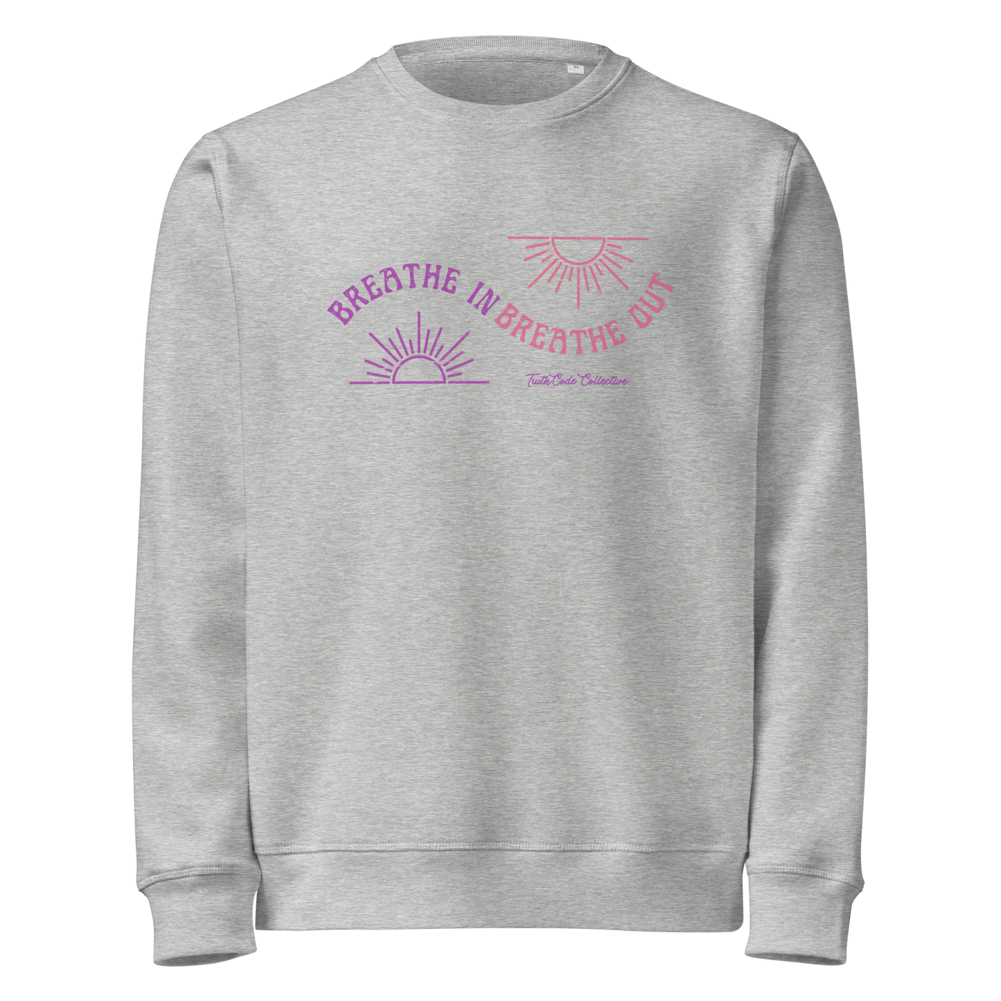 Gray organic sweatshirt with pink and purple sun design and text 'Breathe in breathe out' on a white background