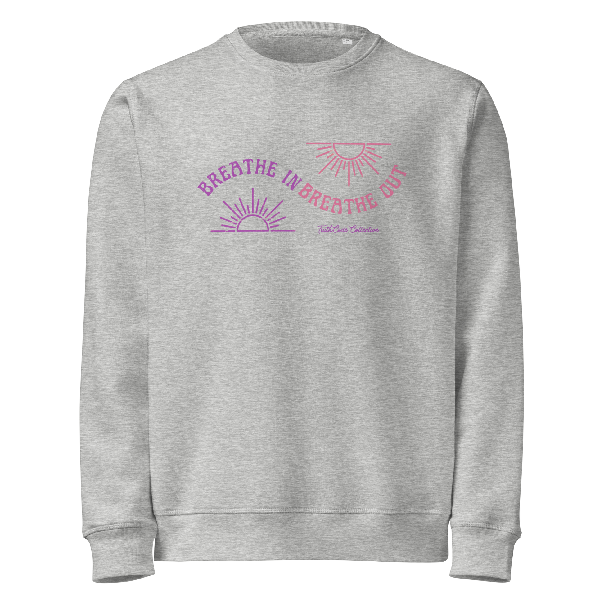 Gray organic sweatshirt with pink and purple sun design and text 'Breathe in breathe out' on a white background