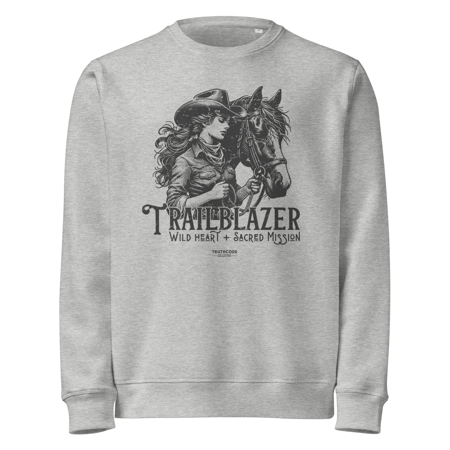Gray organic sweatshirt with graphic of a woman holding a horse and text 'Trailblazer' and 'Wild heart, sacred mission' on a white background