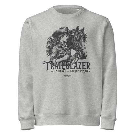 Gray organic sweatshirt with graphic of a woman holding a horse and text 'Trailblazer' and 'Wild heart, sacred mission' on a white background