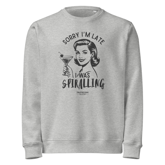 Gray organic sweatshirt with vintage graphic design of woman holding a drink and text 'Sorry I'm late I was spiraling' on a white background