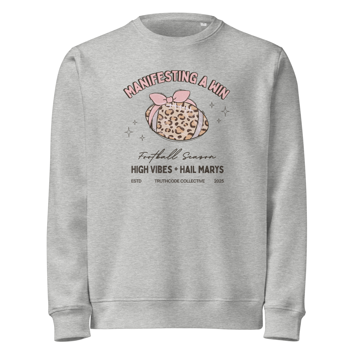 Gray organic sweatshirt with girly football graphic design and text 'Manifesting a win, high vibes + hail marys' on a white background