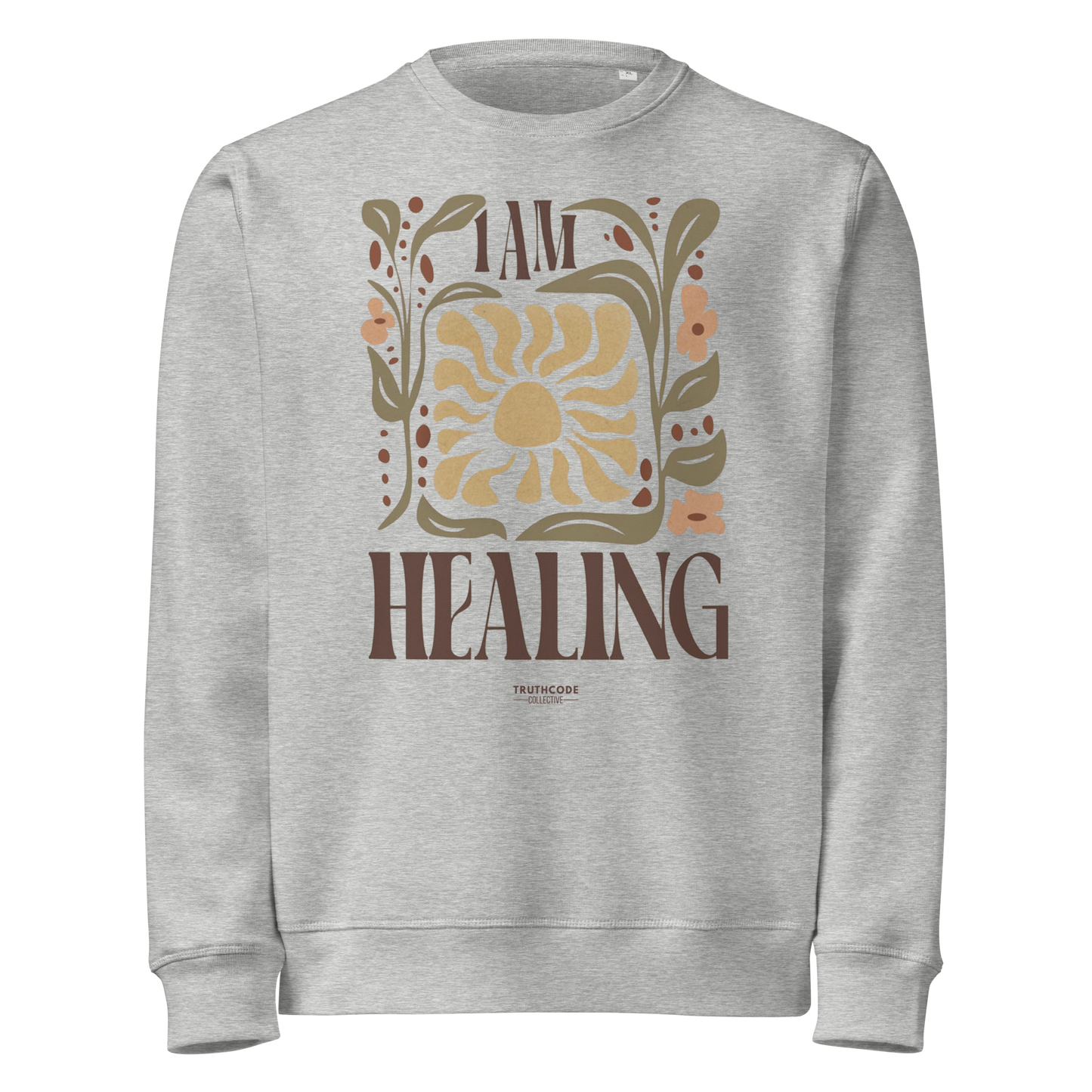 Gray organic sweatshirt with 'I AM HEALING' text and sun and plants design on a white background