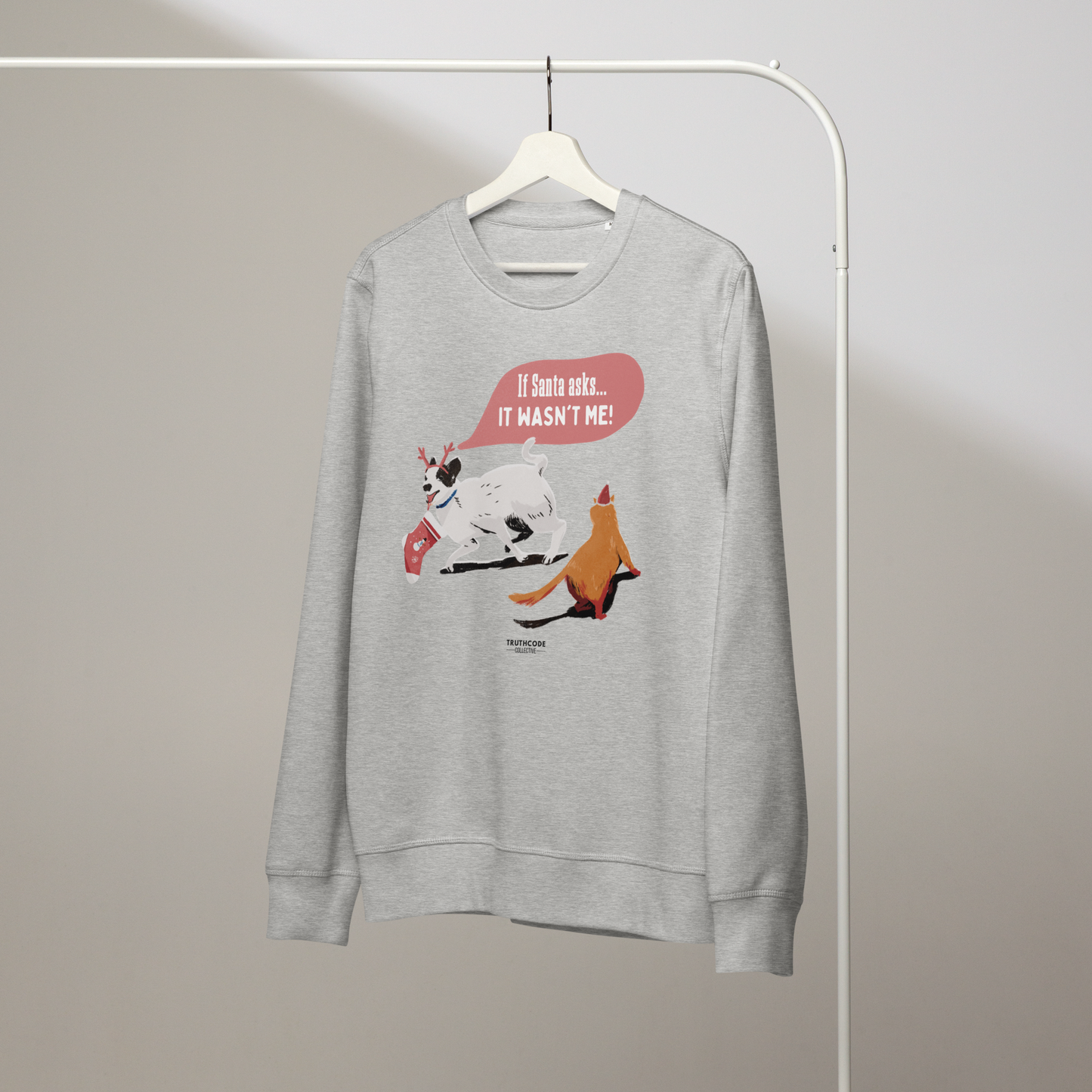 Gray sweatshirt with cartoon design on a hanger against a plain background